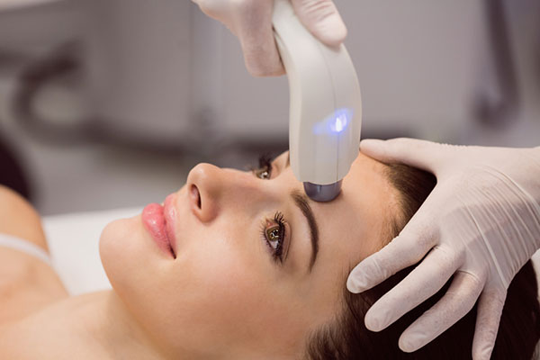 Professional multi-handpiece laser machine used for skin and hair treatments at Dr Padma’s