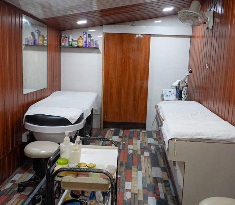 Clean, well-equipped skin treatment room at Dr Padma’s Salon with facial beds and skincare equipment