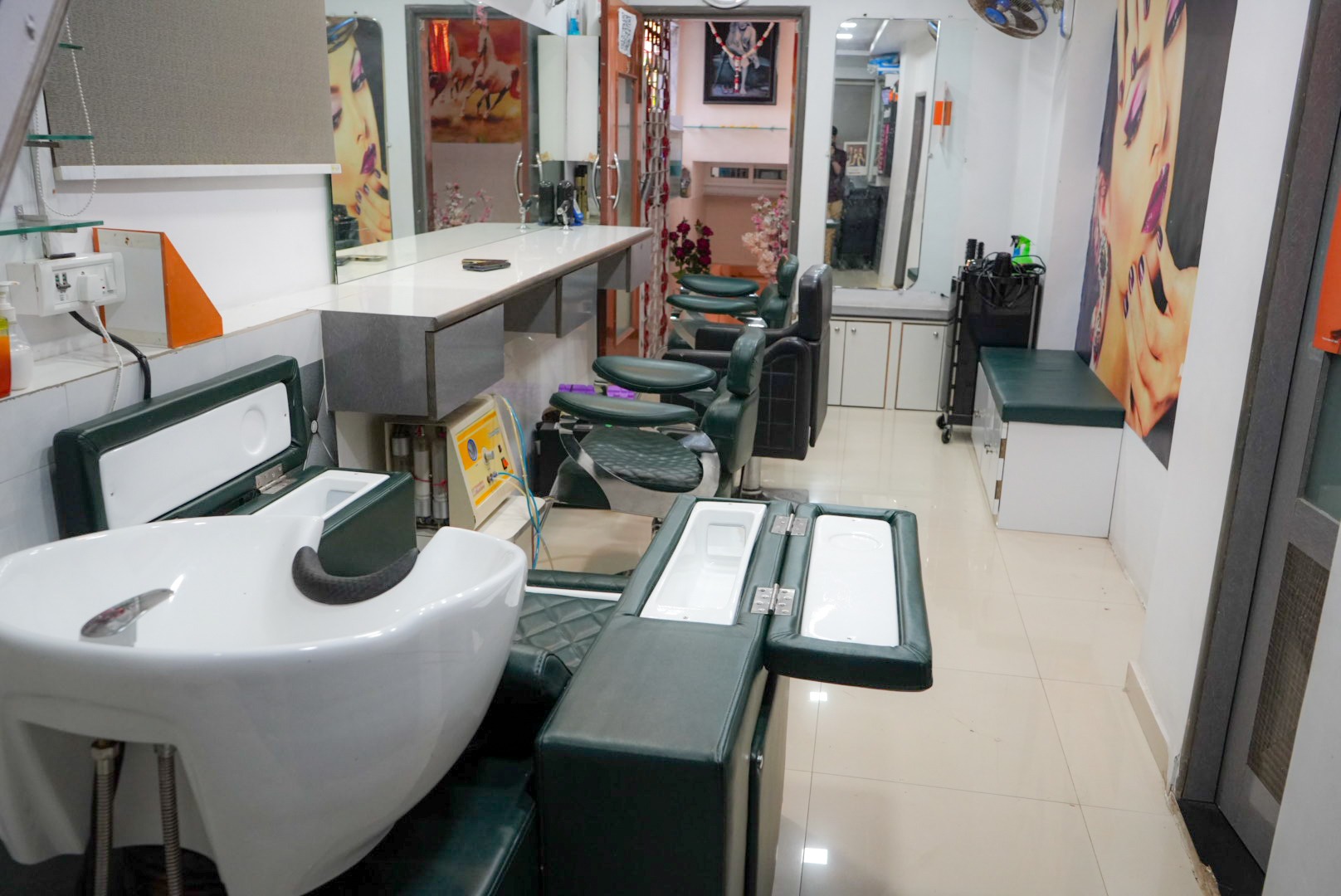 Fully equipped salon training floor with styling stations and wash units
